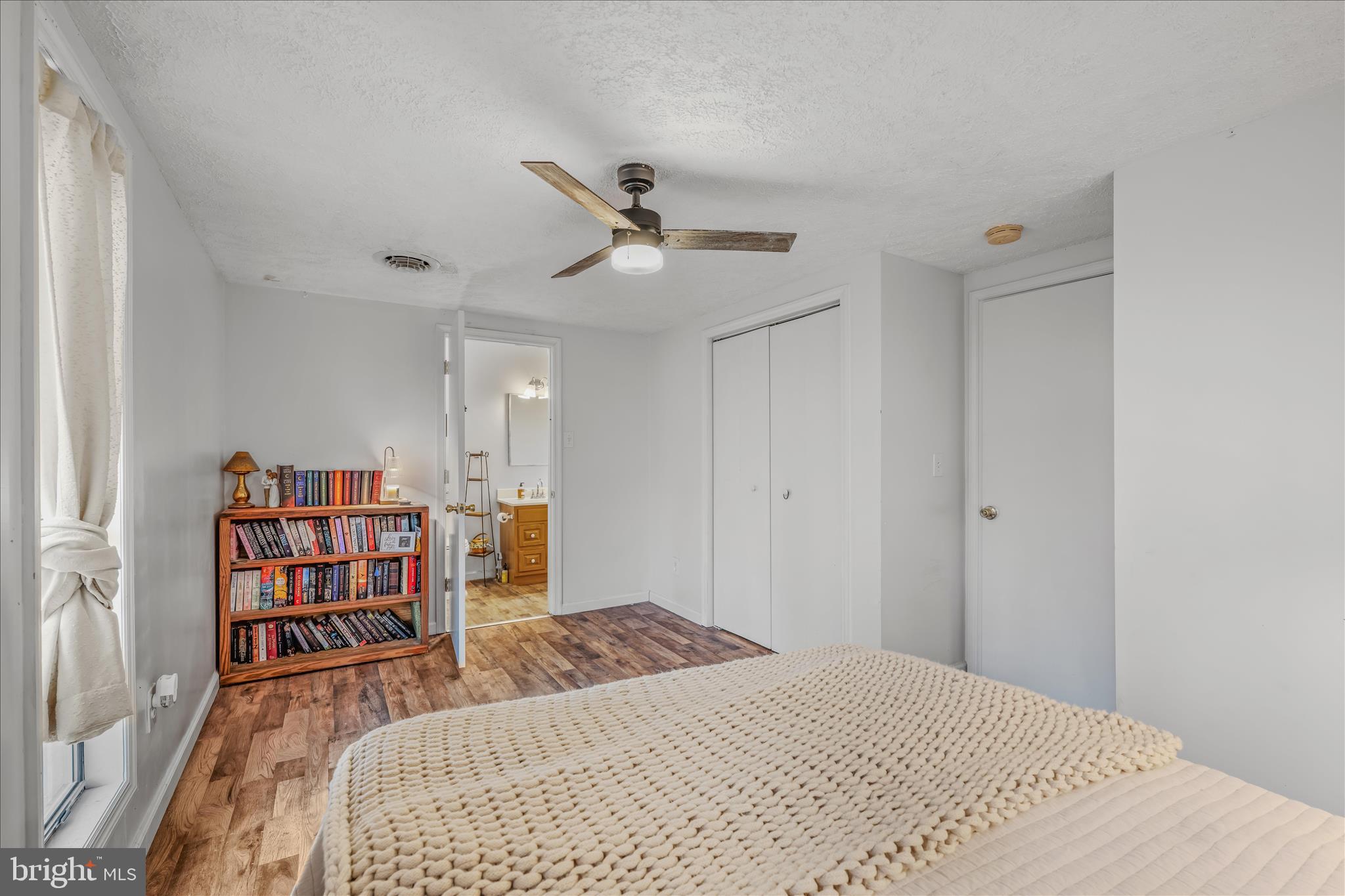 384 Trapper Ridge Lane Hedgesville, WV 25427 - Photo 21 of 52 a bedroom with a bed and a book shelf
