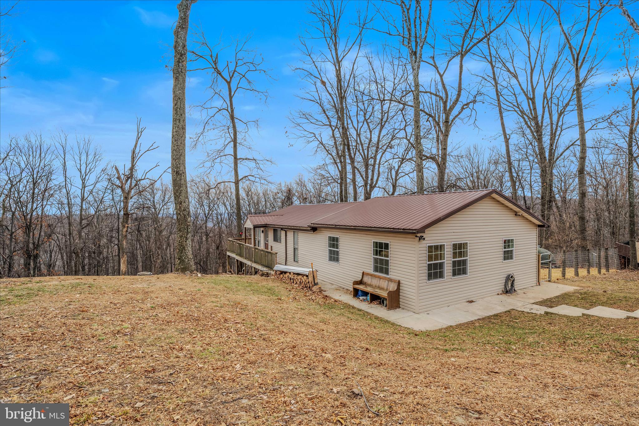 384 Trapper Ridge Lane Hedgesville, WV 25427 - Photo 28 of 52 a white house that has a tree in front of it