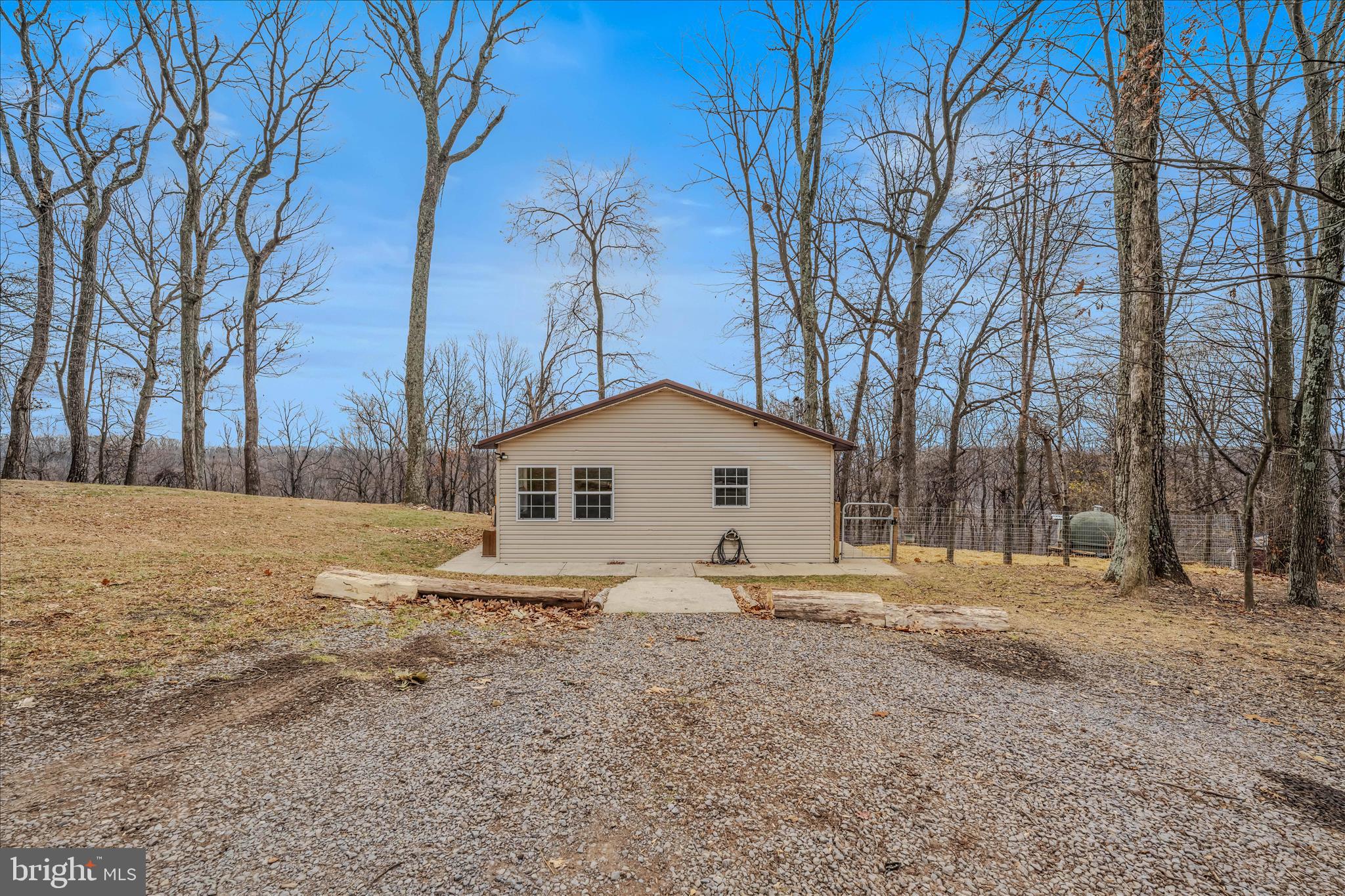 384 Trapper Ridge Lane Hedgesville, WV 25427 - Photo 29 of 52 a white house that has a tree in front of it