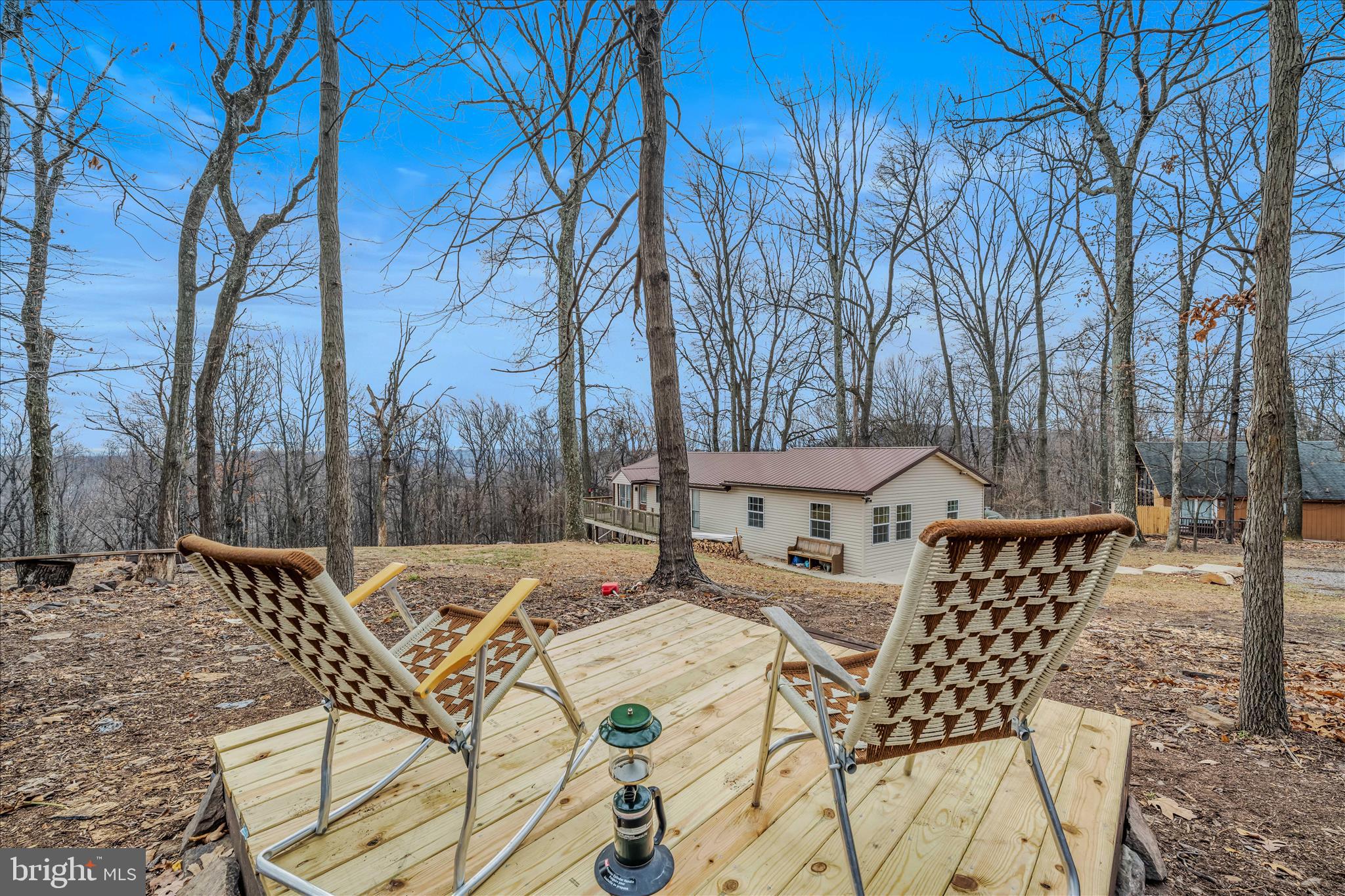 384 Trapper Ridge Lane Hedgesville, WV 25427 - Photo 33 of 52 a view of patio with table and chairs and wooden floor