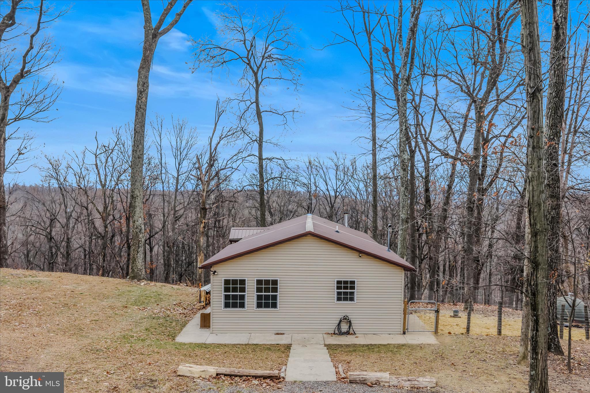 384 Trapper Ridge Lane Hedgesville, WV 25427 - Photo 34 of 52 a view of a house with a backyard