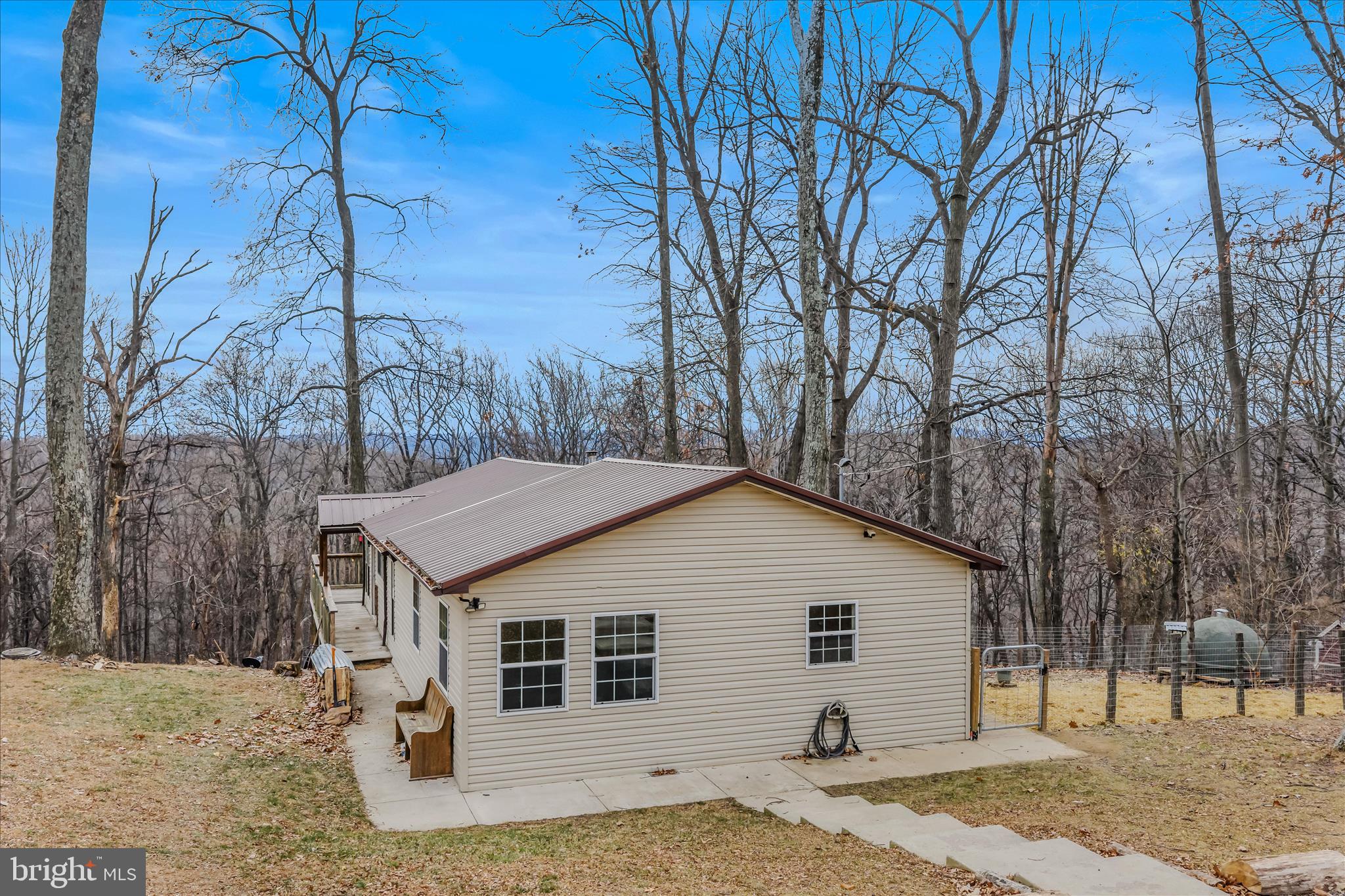 384 Trapper Ridge Lane Hedgesville, WV 25427 - Photo 35 of 52 a view of a white house with a large tree