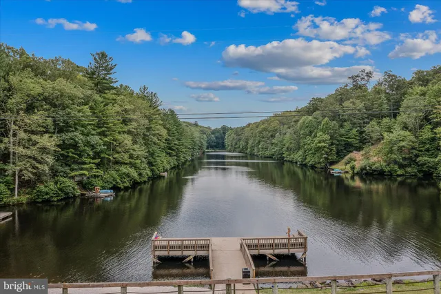 a view of a lake with a house in the background
