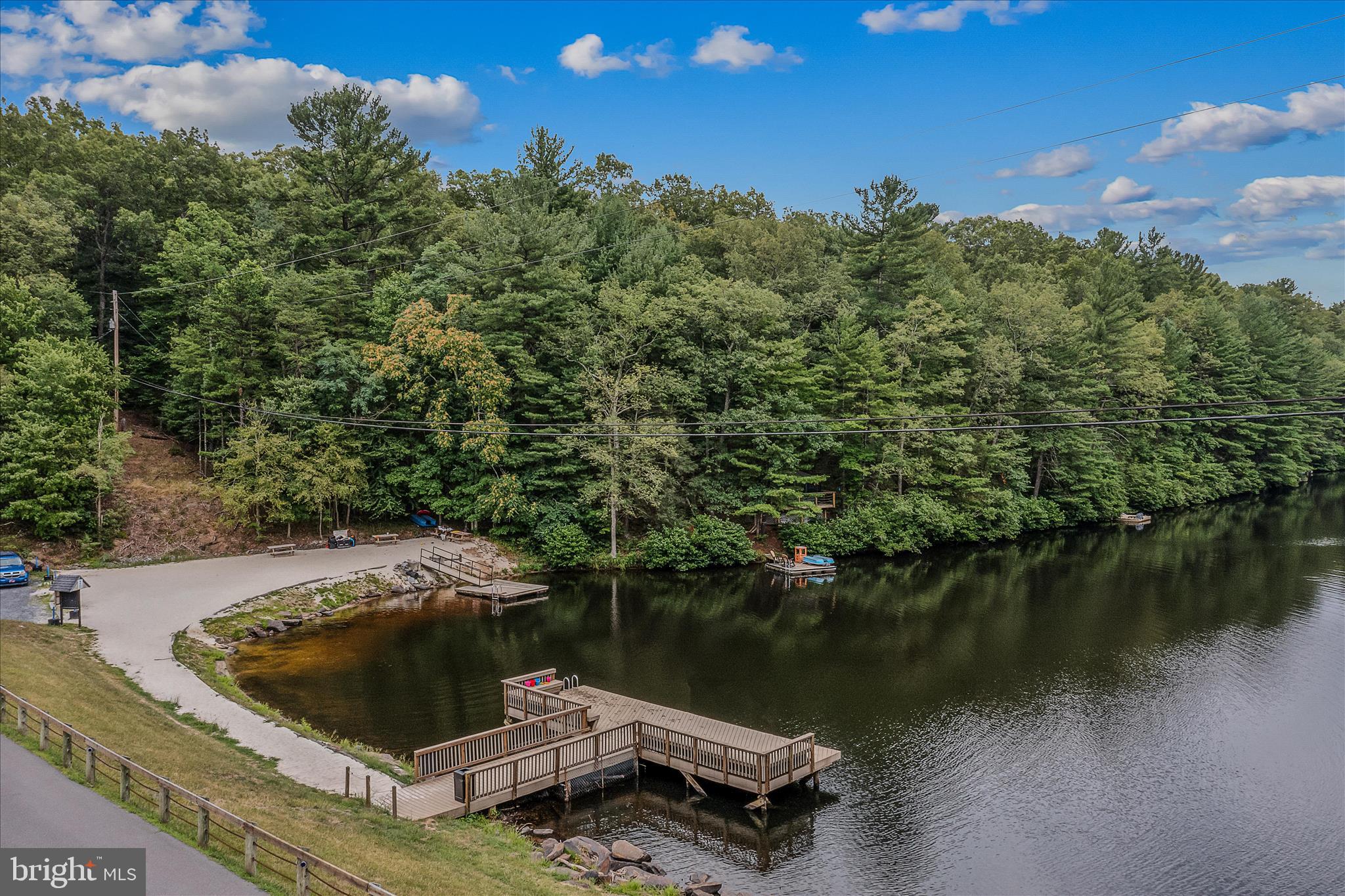 384 Trapper Ridge Lane Hedgesville, WV 25427 - Photo 50 of 52 a view of a lake with a house in the background