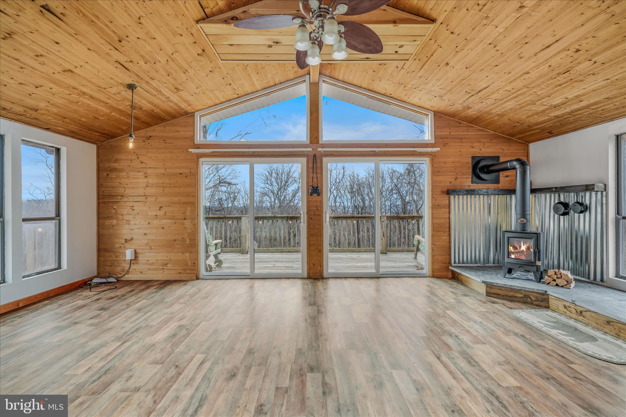 384 Trapper Ridge Lane Hedgesville, WV 25427 - Photo 6 of 52 a view of an empty room with wooden floor and a window