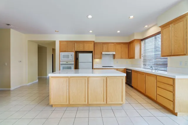 a view of livingroom with furniture wooden floor and windows