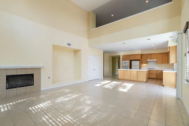 a view of a kitchen with a sink and a window