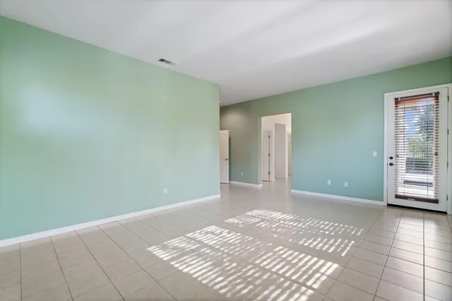 a bathroom with a granite countertop tub sink and mirror