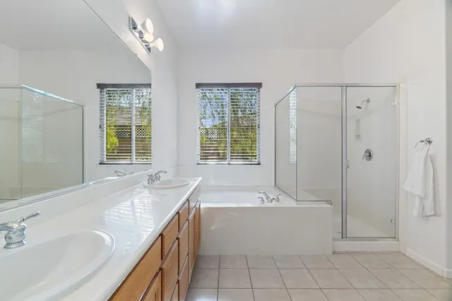 an empty room with a windows and closet