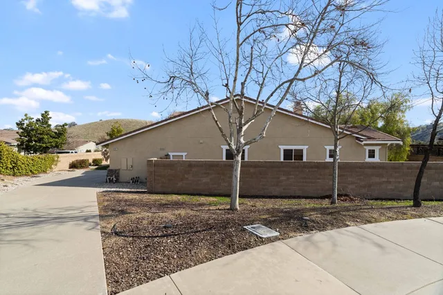 a house that has a tree in front of it