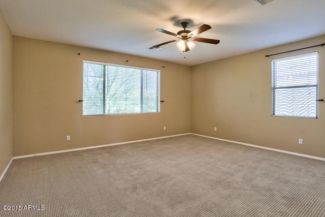 13652 West Calavar Road Surprise, AZ 85379 - Photo 21 of 39 Bedroom_One.jpg