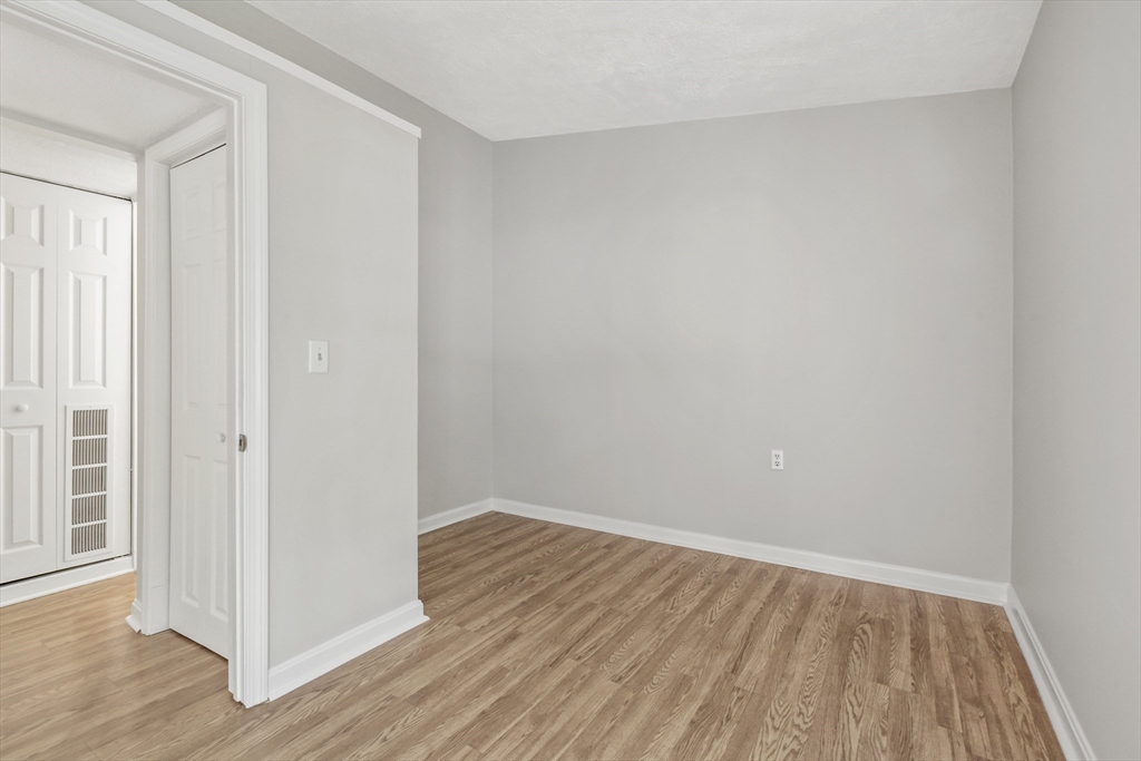 4 Depot Street Upton, MA 01568 - Photo 12 of 26 a view of an empty room with wooden floor