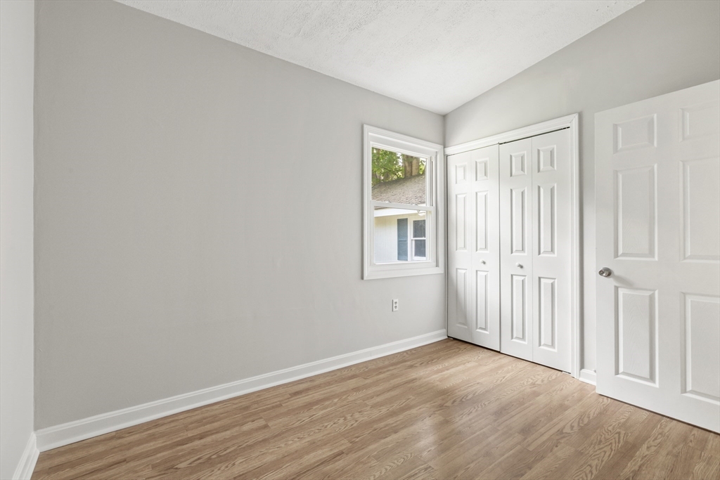 4 Depot Street Upton, MA 01568 - Photo 13 of 26 an empty room with wooden floor and windows