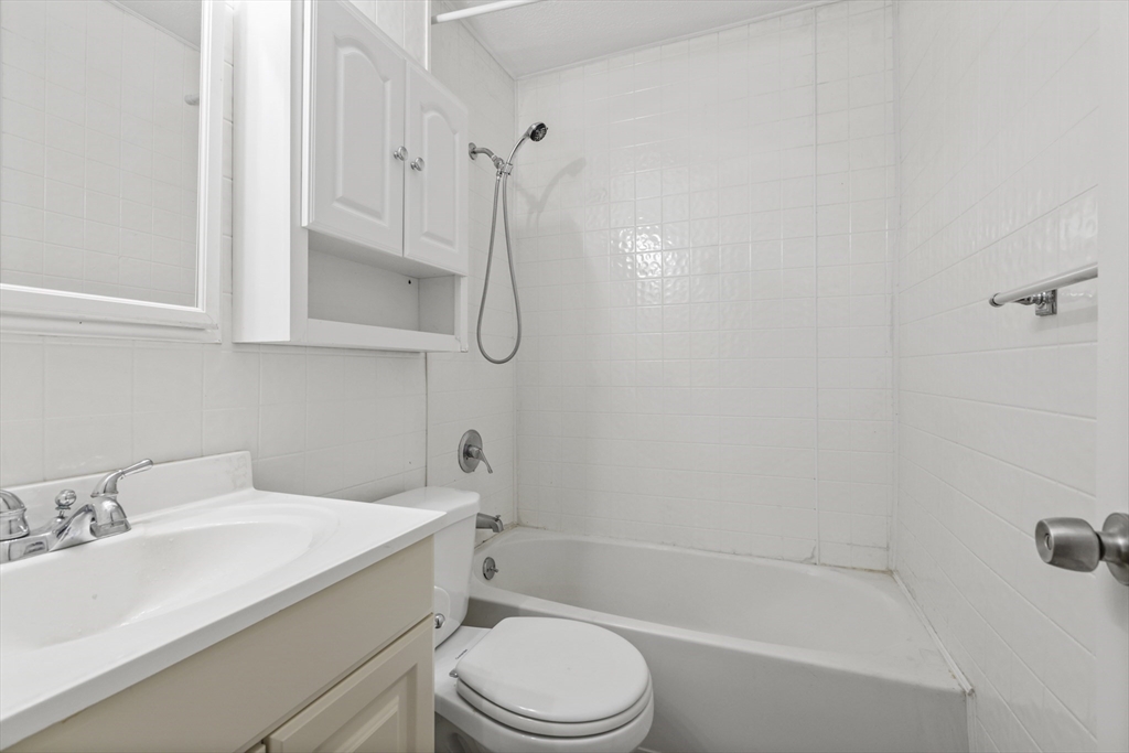 4 Depot Street Upton, MA 01568 - Photo 16 of 26 a bathroom with a granite countertop sink toilet and shower