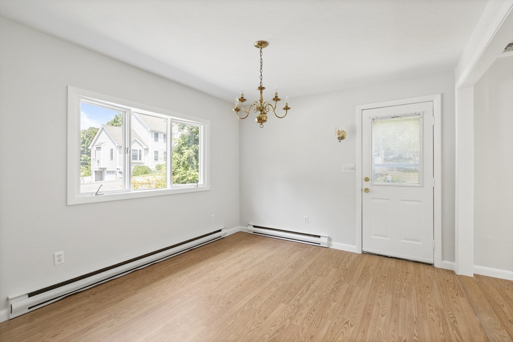 4 Depot Street Upton, MA 01568 - Photo 18 of 26 wooden floor in an empty room with a window