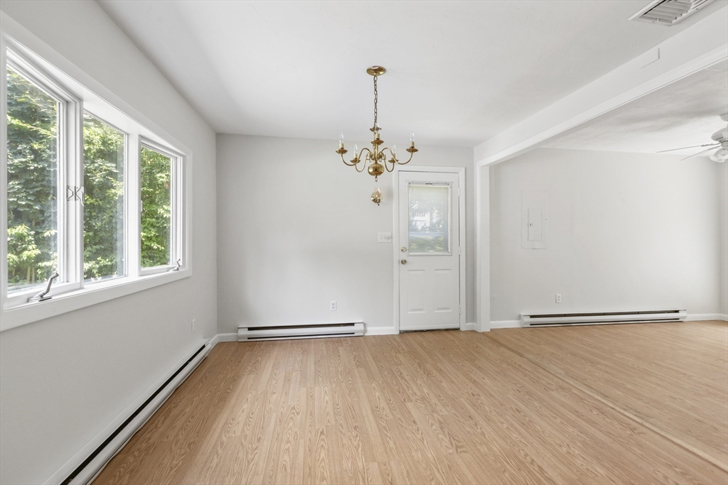 4 Depot Street Upton, MA 01568 - Photo 19 of 26 a view of a livingroom with wooden floor and a large window