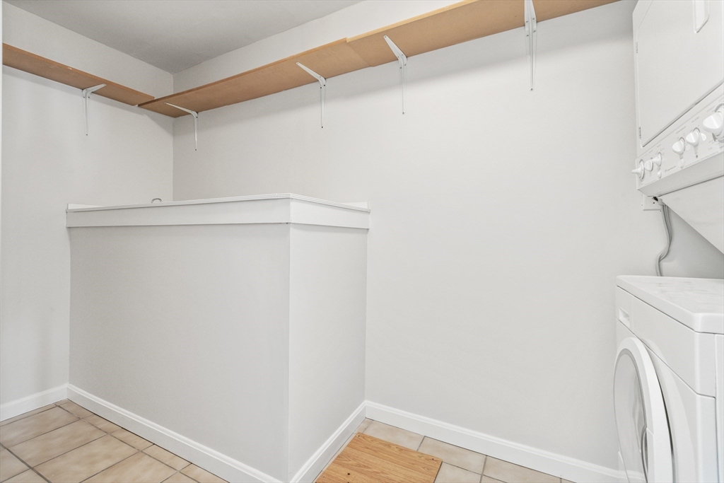 4 Depot Street Upton, MA 01568 - Photo 23 of 26 a view of storage and utility room with washer and dryer