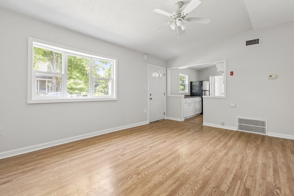 4 Depot Street Upton, MA 01568 - Photo 5 of 26 a view of empty room with wooden floor and fan
