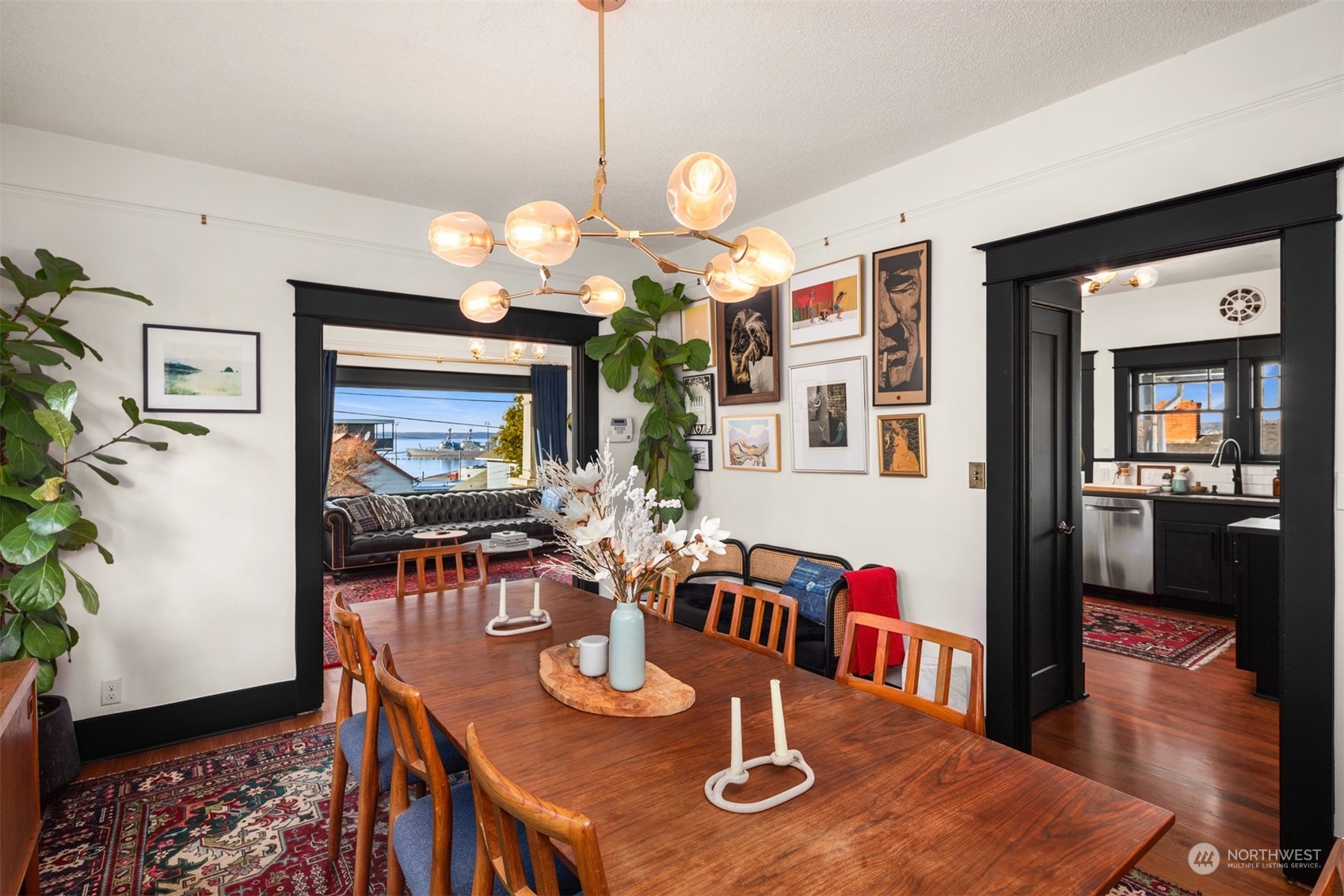 3009 Gedney Street Everett, WA 98201 - Photo 11 of 40 a view of a dining room with furniture a chandelier and wooden floor