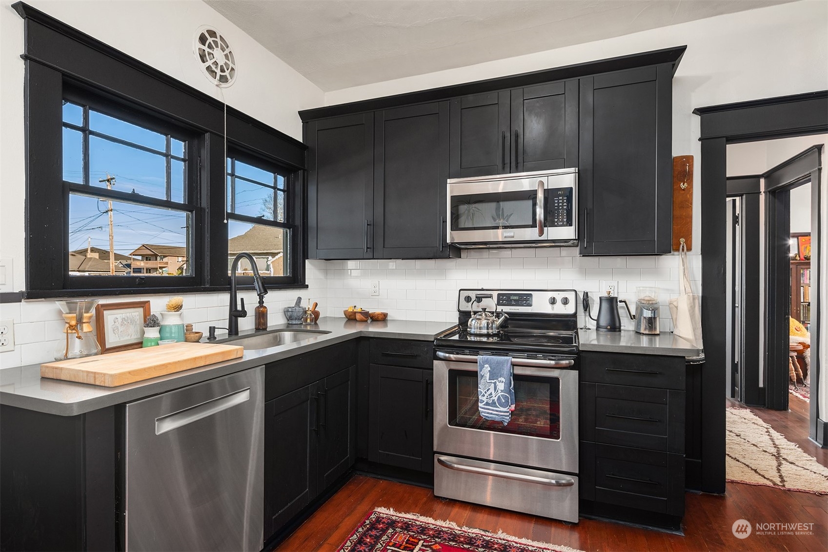 3009 Gedney Street Everett, WA 98201 - Photo 17 of 40 a kitchen with a stove sink and microwave