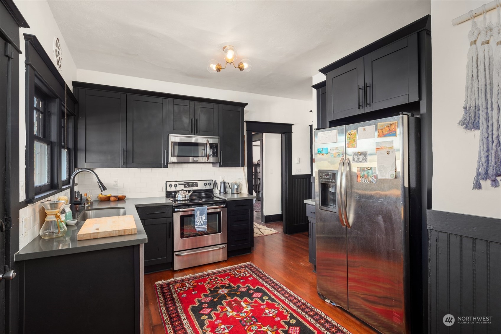 3009 Gedney Street Everett, WA 98201 - Photo 18 of 40 a kitchen with stainless steel appliances granite countertop a refrigerator stove and sink
