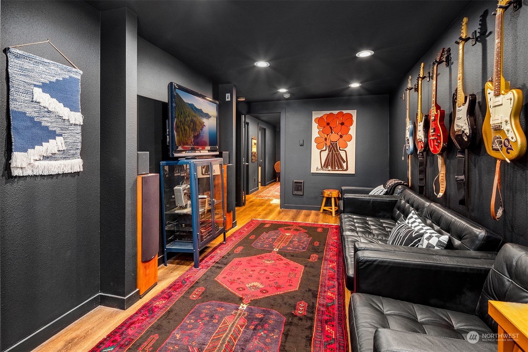 3009 Gedney Street Everett, WA 98201 - Photo 23 of 40 a living room with furniture a flat screen tv and a fireplace