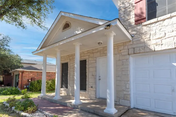a front view of a house with a porch