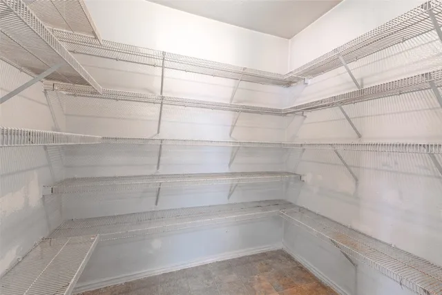 a view of a room with racks on the wall