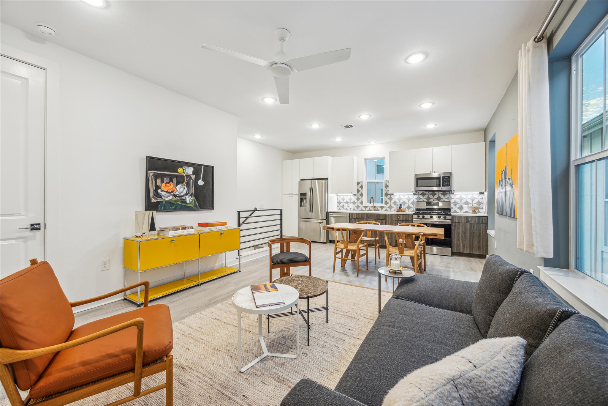 Living area featuring recessed lighting, ceiling fan, and light wood-type flooring