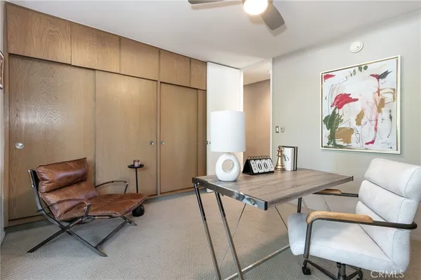 a room with a sink and large window