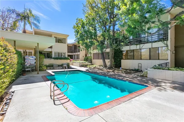 a view of a swimming pool with a patio