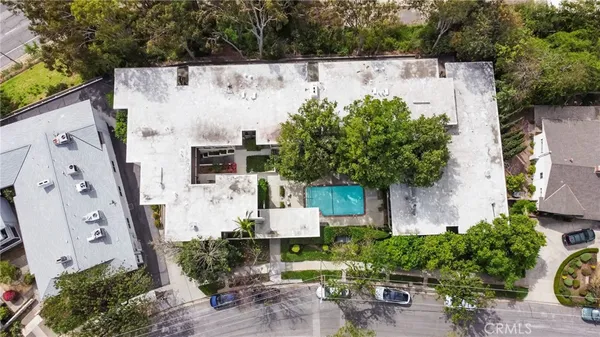 an aerial view of multiple house with outdoor space