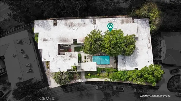 an aerial view of a house with a yard