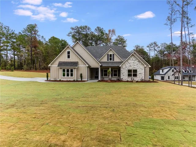 a front view of a house with swimming pool