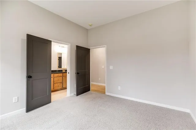 a view of empty room with a fireplace