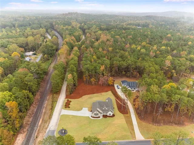 a view of a yard with two chairs