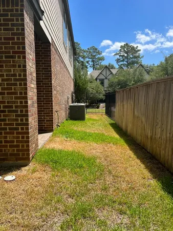 a view of a backyard with plants and a garden