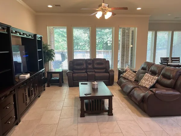a living room with furniture and a flat screen tv