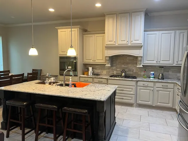 a kitchen with a sink and cabinets