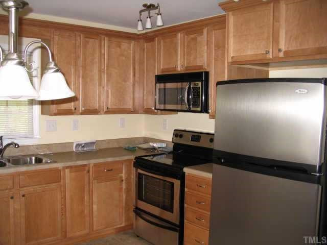 8311 Hempshire Place Raleigh, NC 27613 - Photo 5 of 7 Fabulous kitchen- maple cabinets, SS appliances, breakfastroom Other