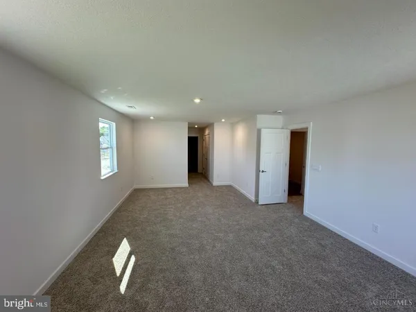 a view of a livingroom and a hallway