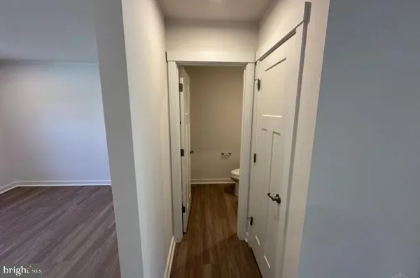 a view of a bathroom from a hallway