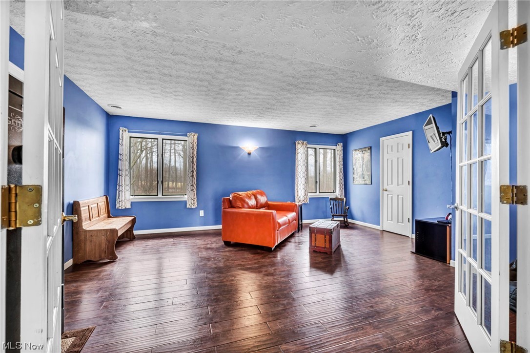 3324 Poe Road Medina, OH 44256 - Photo 13 of 26 Sitting room with dark hardwood / wood-style floors and a textured ceiling