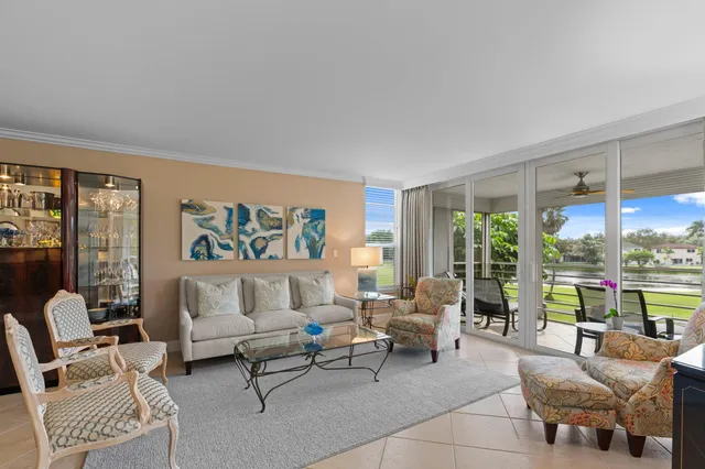 a living room filled with furniture and a window