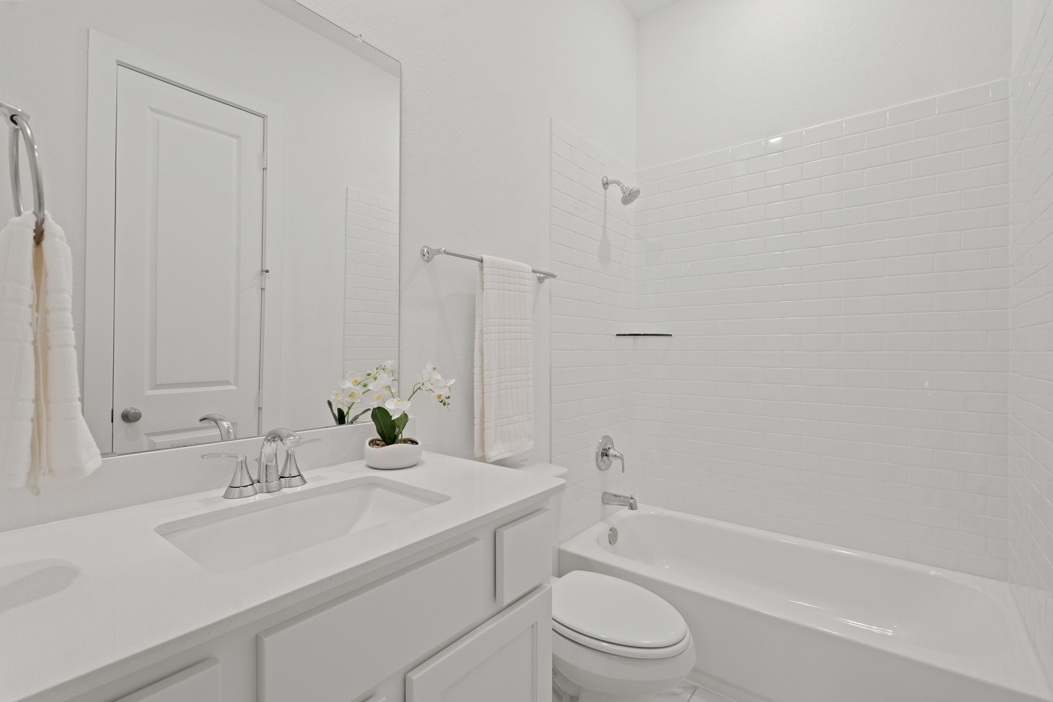 7303 Compass Drive Katy, TX 77493 - Photo 21 of 31 a bathroom with a bathtub shower sink and toilet