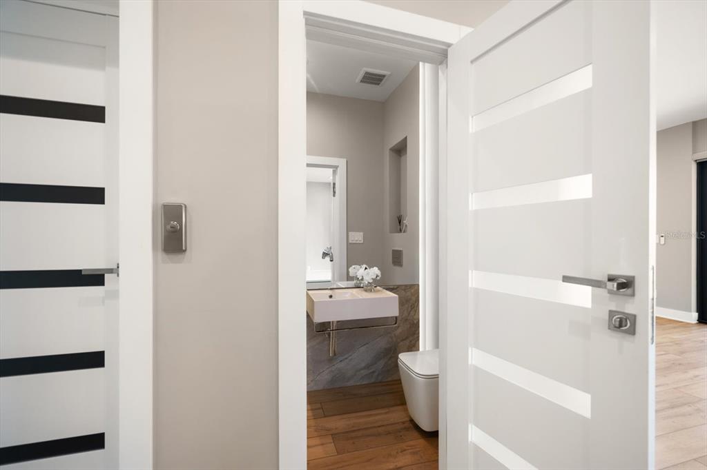 16047 Redington Drive Redington Beach, FL 33708 - Photo 24 of 80 a bathroom with a sink a toilet and shower