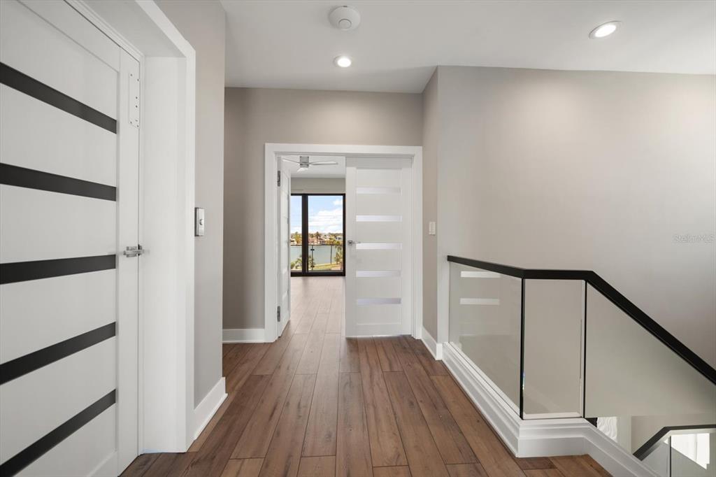 16047 Redington Drive Redington Beach, FL 33708 - Photo 40 of 80 a view of hallway with wooden floor