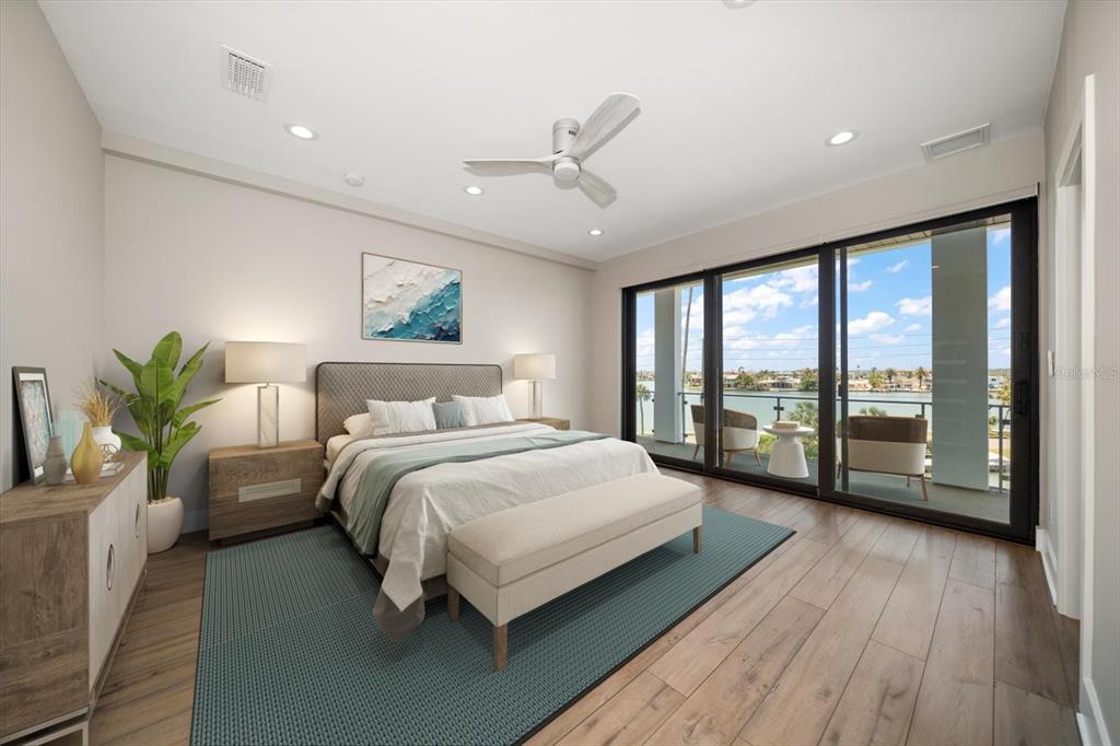 16047 Redington Drive Redington Beach, FL 33708 - Photo 41 of 80 a bedroom with a large bed and a large window