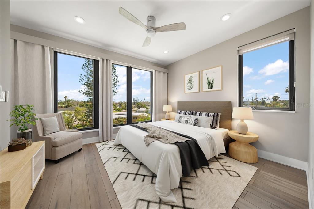 16047 Redington Drive Redington Beach, FL 33708 - Photo 56 of 80 a spacious bedroom with a large bed and a large window