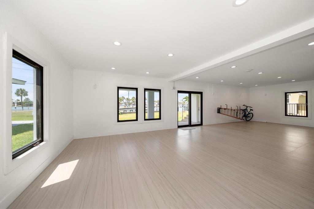 16047 Redington Drive Redington Beach, FL 33708 - Photo 67 of 80 a view of an empty room with a window and wooden floor